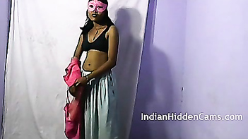 Indian masked aunty doing striptease.