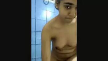 Uncovering Desi Beauty: Watch This Cute Girl Undress in the Bathroom