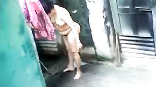Desi large ass aunty outdoor bath captured by neighbor