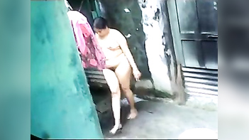 Desi large ass aunty outdoor bath captured by neighbor