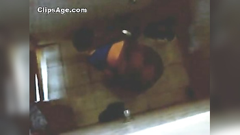 Indian Desi home nurse taking bath captured using hidden webcam placed on roof .