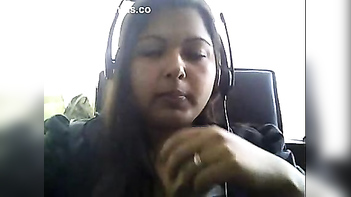 Hot Indian Aunty on Webcam Sqeezing her Naked Large Boobs Mms