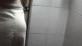 Indian aunt stripping dress and taking bath movie clip exposed