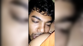 Desi Aunty Caught Feeding Titties to Neighbor Guy: Shocking Video Goes Viral!