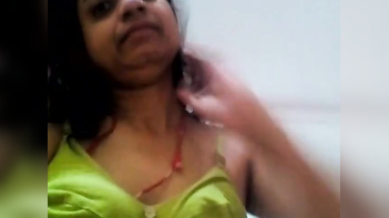Indian MILF Flaunts Her Busty Assets in X-Rated Sex Video