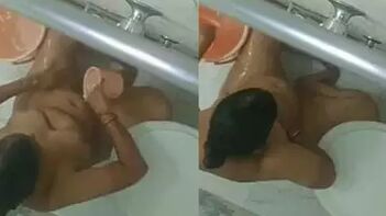Indian Woman's Joyful Reaction to Porn Video Filmed in the Shower Room