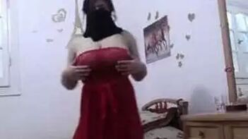 Sultry Desi Woman in Mask Poses Alluringly in Bedroom With Her Voluptuous Bust