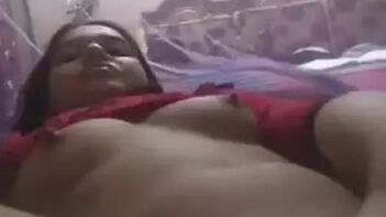 Sultry Indian Woman Lies in Bed With Bare Breasts, Awaiting Her Lover