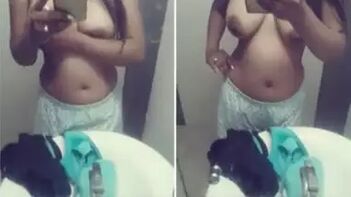 Indian Sexpot Captures Her Saggy Xxx Boobs in Mirror After Workout