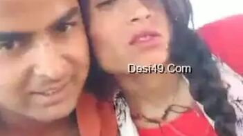 Handsome Young Man Gently Grazes Indian Woman's Perfect Breasts Through Red Dress