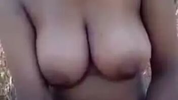 Watch Mallu Aunty Flaunt Her Big Boobs Outdoors in This Indian Porn Tube Video