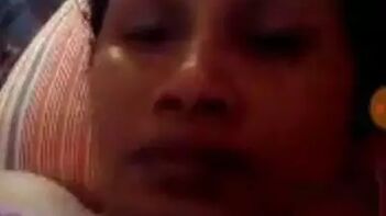 Indian Milf Seductively Laying In Bed, Tugging Those Juicy Knockers Like A Tease