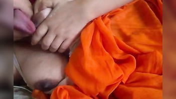 Middle-Aged Indian Diva in Vibrant Orange Sari Flashing Her Juicy Xxx Titties