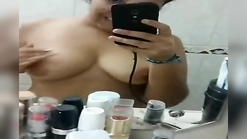 Desi Chick Masturbates and Touches Her Juicy Tits in Front of the Mirror