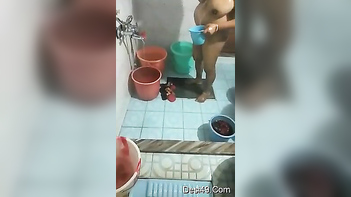Desi chubby pours water all over her naked body, teasing the fuckin' hidden cam