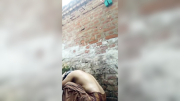 Desi Bhabi Gets Wild in Outdoor Bath, Soaking Wet and Totally Naked