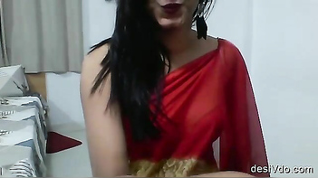 Desi Chick in Red Saree Squeezing Her Juicy Tits Like a Pro