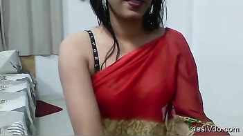 Desi Chick in Red Saree Squeezing Her Juicy Tits Like a Pro