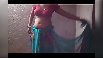Experience Desi Passion with Hot Bhabhi Removing Saree and Standing in Inner Wears