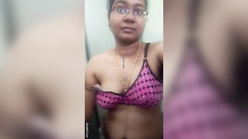 Indian Chick With Glasses Teases Her Juicy Assets In The Fucking Bathroom