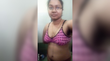 Indian Chick With Glasses Teases Her Juicy Assets In The Fucking Bathroom