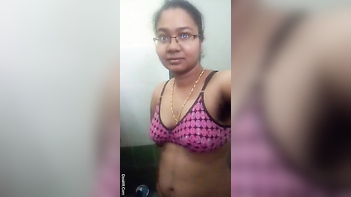 Indian Chick With Glasses Teases Her Juicy Assets In The Fucking Bathroom