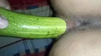 Indian Guy Fucking His GF's Pussy with a Cucumber in the Bedroom