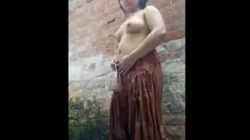 This Indian Hot Babe Getting Soaped Up and Rinsed in a Village Bath!
