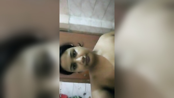 Desi Chick Grabs Camera, Films Her XXX Tits and Pussy in Action