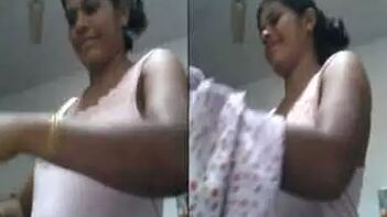 Fiery Bitch Flashes XXX Tits While Slipping Into Sexy Sari, Caught in Wild Act!