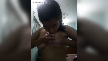 Busty Indian Babe Flashes Giant Tits and Rubs Her Wet Pussy on Webcam.