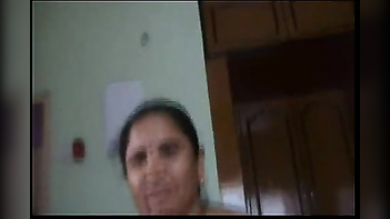 Hot Mallu Maid with Big Boobs Caught Giving a Handjob While Talking on the Phone!