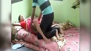 Desi Mom Takes Neighbor's Son's Cock in Steamy Indian Porn Video.