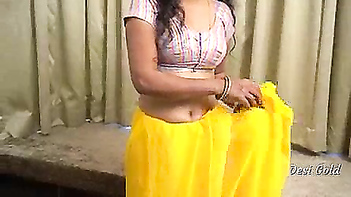 Explore the Sensual Beauty of a Hot Desi Woman in a Yellow Saree