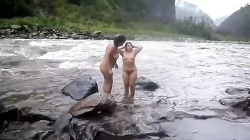 Experience the Beauty of Desi MILFs Taking an Open-Air Shower in a River