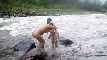 Experience the Beauty of Desi MILFs Taking an Open-Air Shower in a River