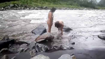 Experience the Beauty of Desi MILFs Taking an Open-Air Shower in a River