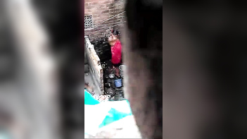 Desi Bhabhi Taking an Open Air Shower Right Next Door!