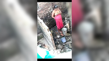 Desi Bhabhi Taking an Open Air Shower Right Next Door!