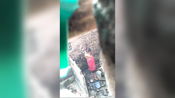 Desi Bhabhi Taking an Open Air Shower Right Next Door!