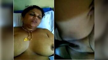 Sizzling Mallu Bhabhi Enjoys Sensual Self-Pleasure by Sucking Her Own Breasts