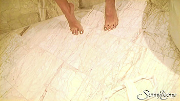 Sunny Leone with Big Juicy Tits Strips and Teases Like a Damn Pro