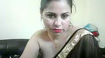 Indian Aunty Meenakshi in Tight Black Sari Shows Off Her Curvy Body