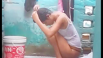 Indian Babe Gets Soaked and Sexy as She Takes a Juicy Outdoor Shower