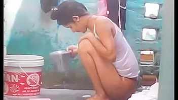 Indian Babe Gets Soaked and Sexy as She Takes a Juicy Outdoor Shower