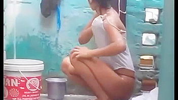Indian Babe Gets Soaked and Sexy as She Takes a Juicy Outdoor Shower