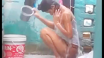 Indian Babe Gets Soaked and Sexy as She Takes a Juicy Outdoor Shower