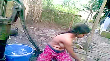 Indian Chick Stripping Down and Washing Up in Public, Damn!
