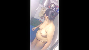 Mature Indian Aunty Gets Caught Naked and Filmed in the Fucking Bathroom